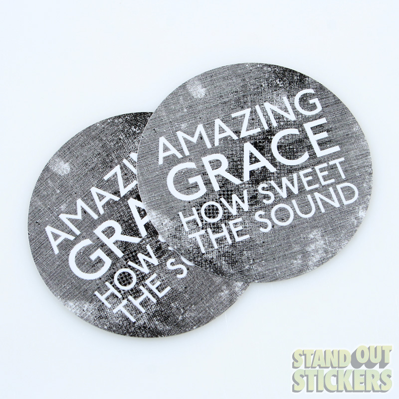 Round stickers printed in black and white featuring the words AMAZING GRACE HOW SWEET THE SOUND